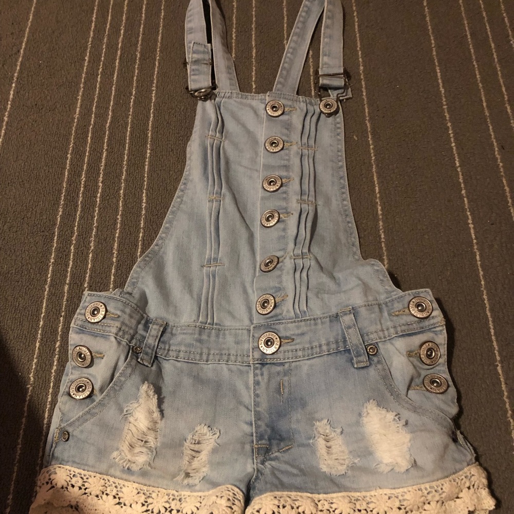 Light blue ripped jean overall
